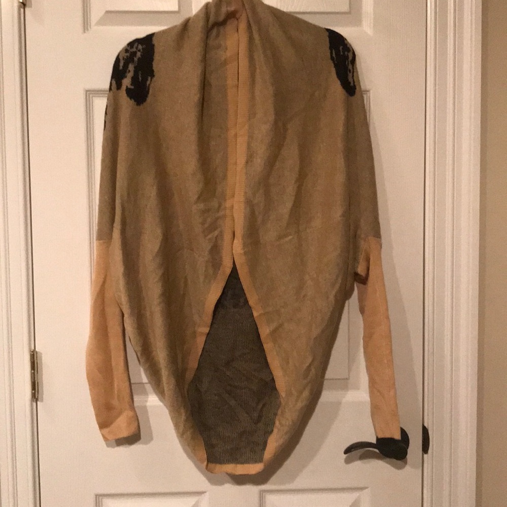 Brown sweater with cheetah on the back.